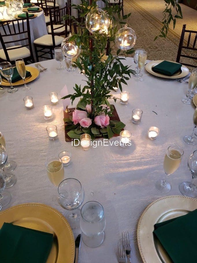 Elegant round table with floral centerpiece and candlelight ambiance.