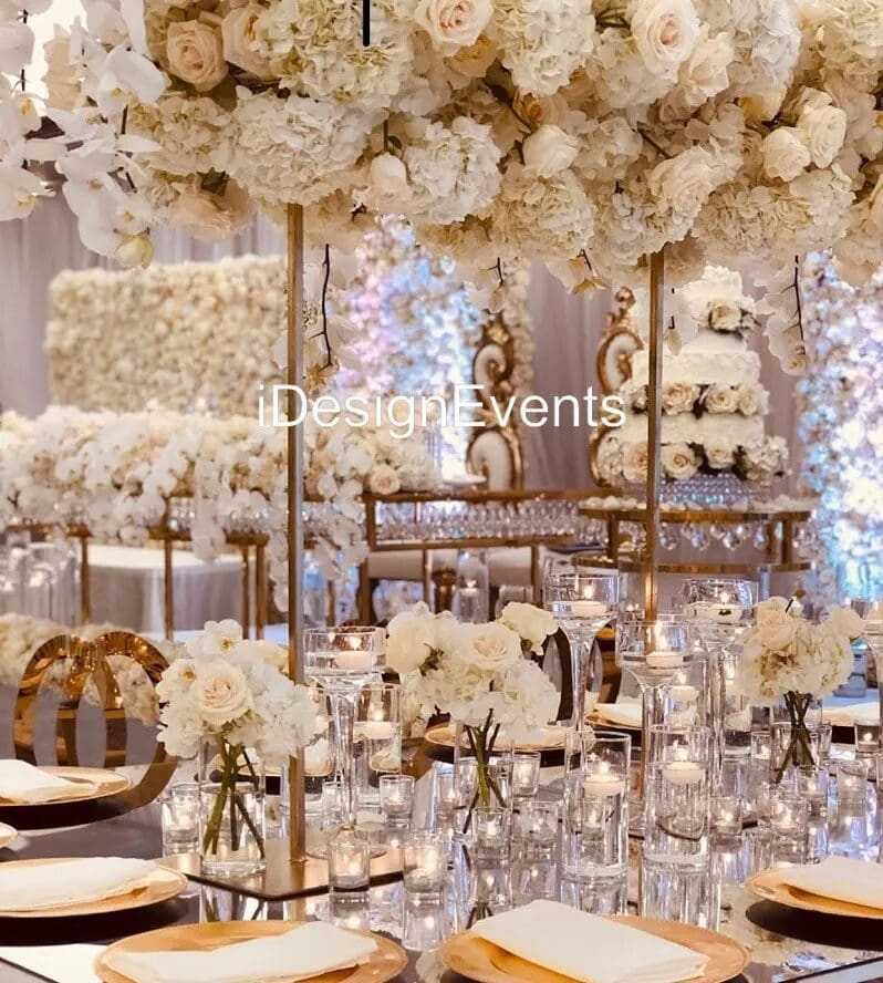 Elegant wedding aisle decorated with white flowers and candles.