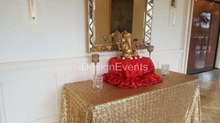 Futuristic roller coaster inside a vibrant, neon-lit indoor amusement park.