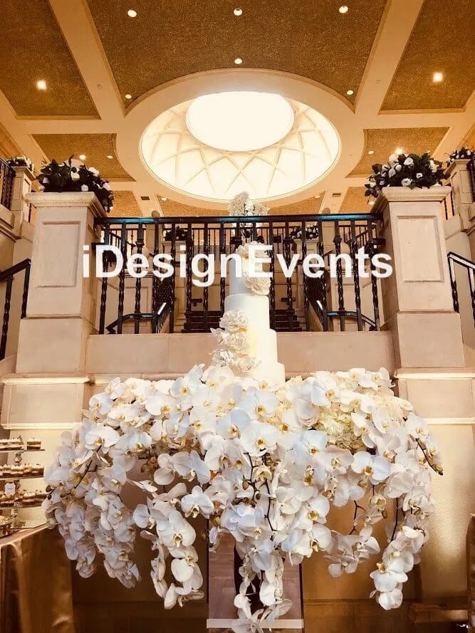 Elegant floral wedding centerpiece in a grand venue.