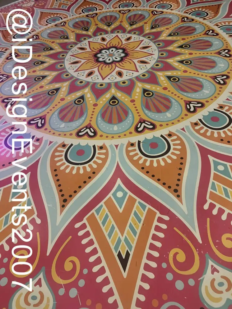 Colorful mandala-inspired geometric floor design with intricate patterns.