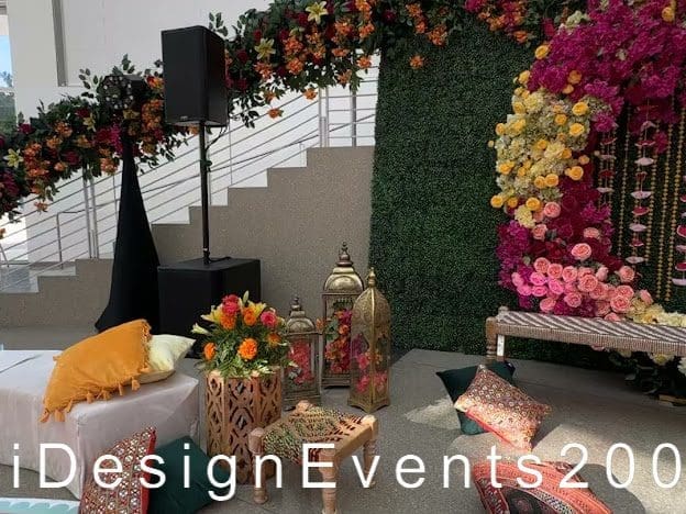 Elegant floral wedding setup with vibrant colors and cozy seating.
