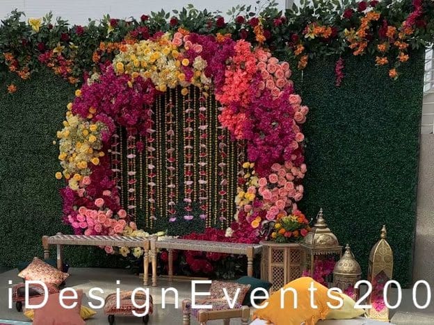 Elegant floral backdrop with vibrant blooms and classic seating for events.