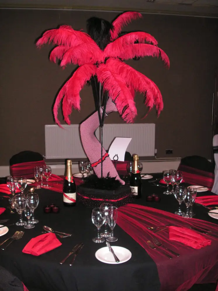 Futuristic roller coaster inside a vibrant, neon-lit indoor amusement park.
