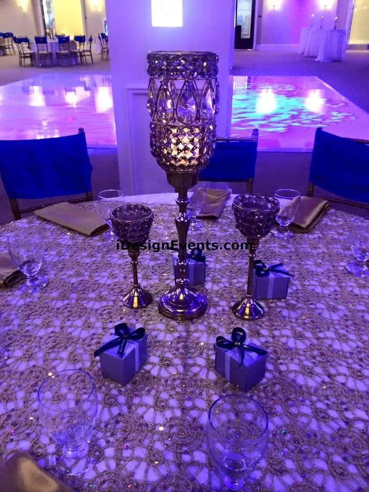 Futuristic roller coaster inside a vibrant, neon-lit indoor amusement park.